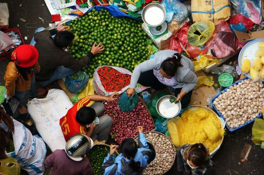 DA LAT, VIET NAM- FEBRUARY 8: People at farmers market in  Dalat, VietNam- February 8, 2013