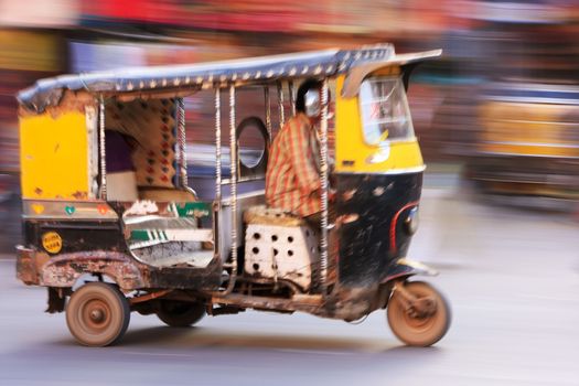 Autorickshaw in the street of Sadar Market, blurred motion, Jodhpur, Rajasthan, India
