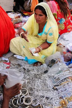 Indian woman selling bangels at Sadar Market, Jodhpur, Rajasthan, India