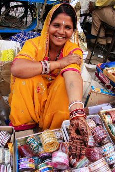 Indian woman showing henna painting, Sadar Market, Jodhpur, Rajasthan, India