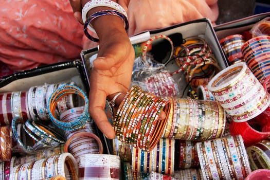 Close up of hand with bangels, Sadar Market, Jodhpur, Rajasthan, India