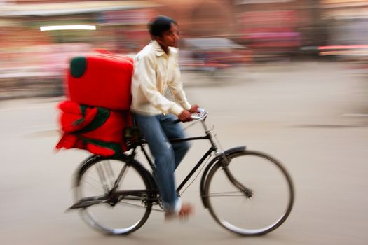 Indian man riding bike, blurred, motion, Sadar Market, Jodhpur, Rajasthan, India