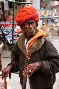 Inidan man walking at Sadar Market, Jodhpur, Rajasthan, India