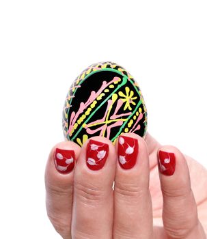 Painted Easter egg woman hand isolated on a white background