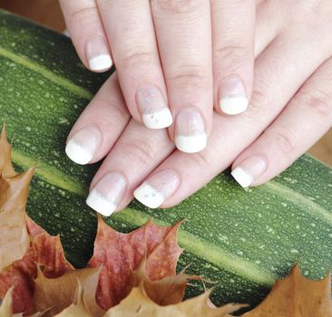 French manicure autumn in the goodies background