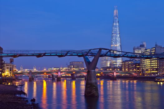 A view of the River Thames with the Shard, Millennium Bridge, Blackfriars Bridge and Tower Bridge in the distance.