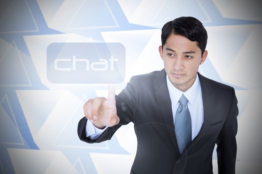 The word chat and unsmiling asian businessman pointing against abstract glowing triangles