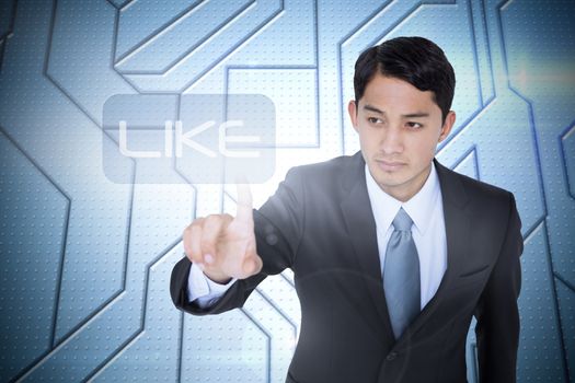 The word like and unsmiling asian businessman pointing against circuit board on futuristic background