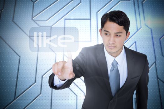 The word like and unsmiling asian businessman pointing against circuit board on futuristic background