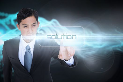 The word solution and unsmiling asian businessman pointing against abstract blue glowing black background