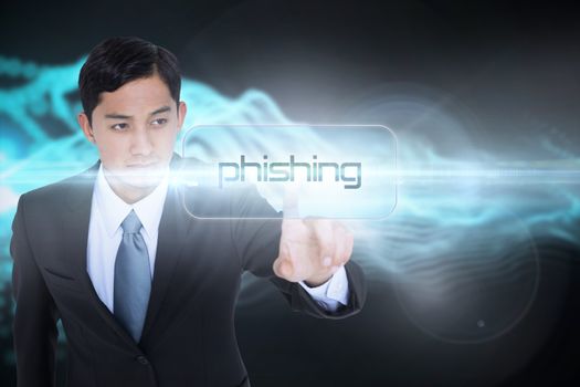 The word phishing and unsmiling asian businessman pointing against abstract blue glowing black background