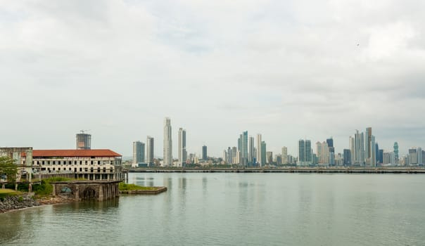 Old Panama houses at Casco Viejo, and  Panama City skyscrapers on the background on a sunny day on January 2, 2014.