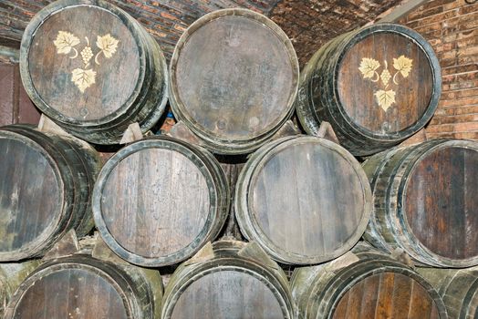 Sant Sadurni d'Anoia, Spain - February 23, 2014: Old Wine barrels in the Codorniu winery. Codorniu winery is located in Sant Sadurni d'Anoia near Barcelona, Spain. The first known document states that the winery is dating to beginning of sixteen century.