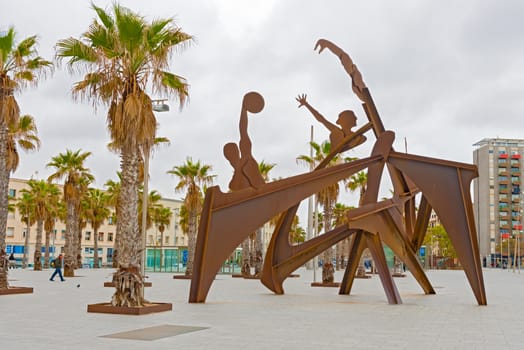 Barcelona, Spain - January 25, 2014:  Olympic sculptures on Plaza del Mar in Barcelona, Spai on sunny day in January 25, 2014