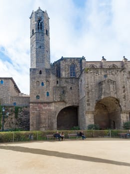 Barcelona, Spain - February 8, 2014: People in the park and Santa Maria del Mar church in Barcelona, Spain on a sunny day in February 8, 2014.