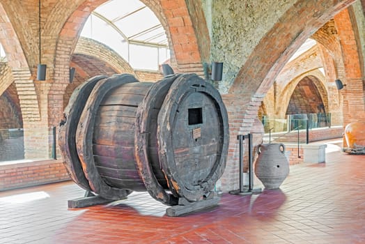 Wine barrel from seventeen century in the entrance hall in Codorniu winery. Codorniu winery is located in Sant Sadurni d'Anoia near Barcelona, Spain. The first known document states that the winery is dating to beginning of sixteen century.