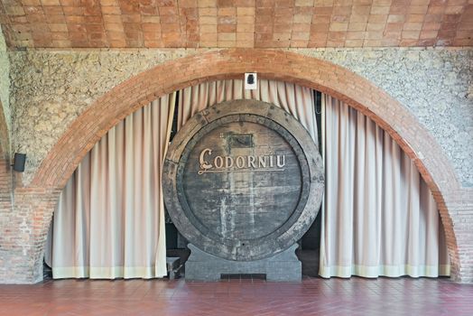 Sant Sadurni d'Anoia, Spain - February 23, 2014: Old Wine barrel in the entrance hall in Codorniu winery. Codorniu winery is located in Sant Sadurni d'Anoia near Barcelona, Spain. The first known document states that the winery is dating to beginning of sixteen century.