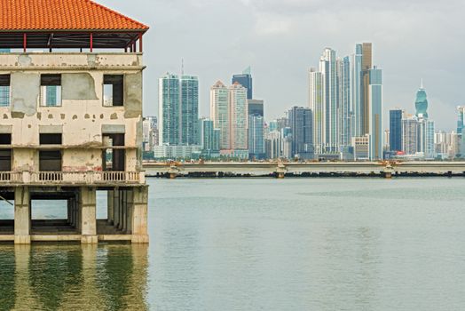 Old Panama houses at Casco Viejo, and  Panama City skyscrapers on the background on a sunny day onJanuary 2, 2014.