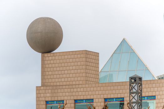 Barcelona, Spain - January 25, 2014: Detail of the Port Olimpic  Village in Barcelona with the big sphere sculpture designed by the famous architect Frank Gehry and erected in 1992. Spain. 