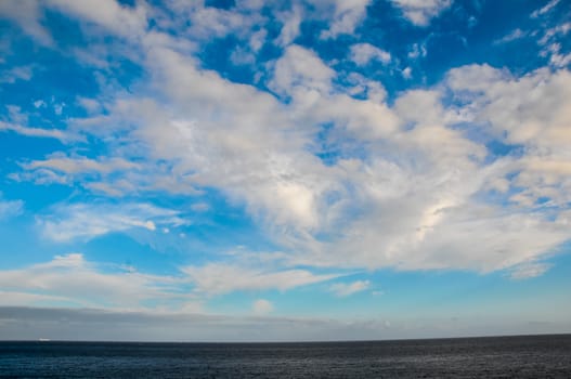 Cloudscape, Colored Clouds at Sunset near the Ocean