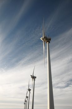 Eletric Power Generator Wind Turbine over a Cloudy Sky