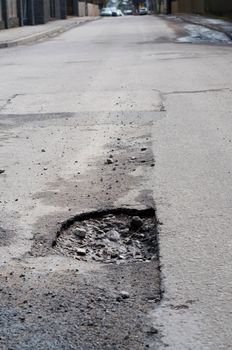 Shot of very big pothole on the road