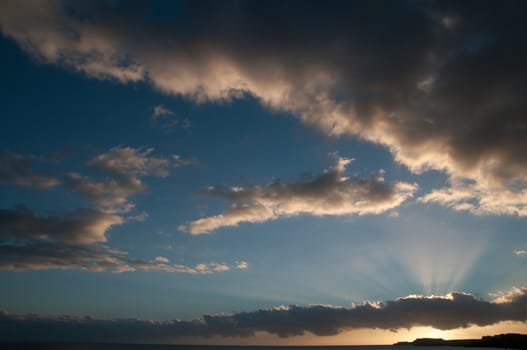 Cloudscape, Colored Clouds at Sunset near the Ocean