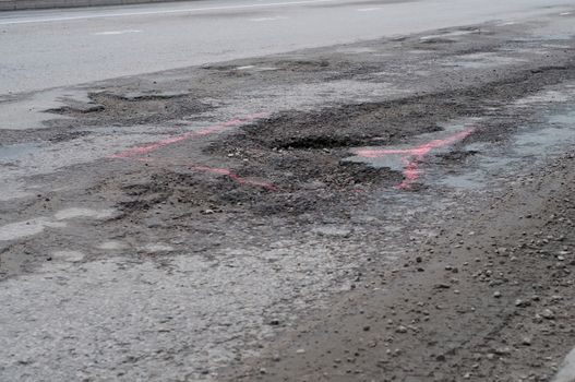 Shot of big pothole on the road