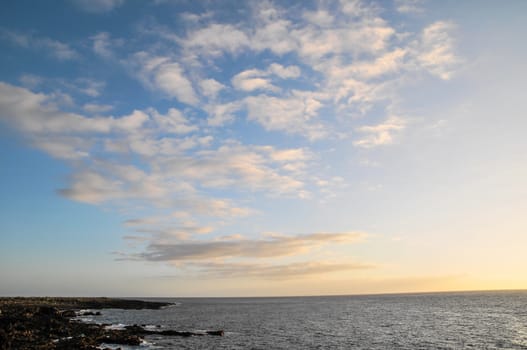 Cloudscape, Colored Clouds at Sunset near the Ocean