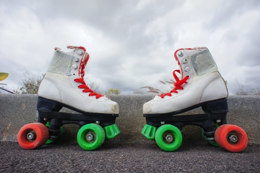 Old Vintage White Skate Boot on the Asphalt Sterret