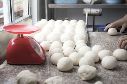 Small balls of fresh pizza dough