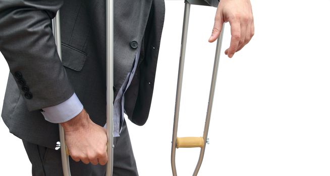 closeup of a business man taking a break with his crutches