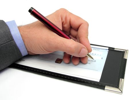 closeup of a hand writing a check