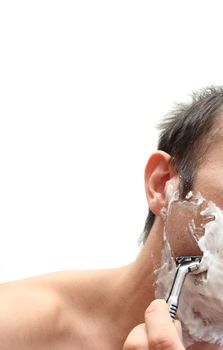 closeup of a man shaving over white