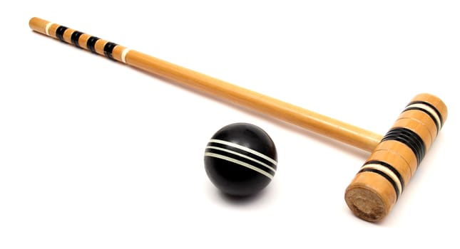 croquet mallet and ball over white