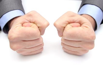 closeup of two fists on a white table