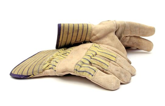 pair of working gloves over white
