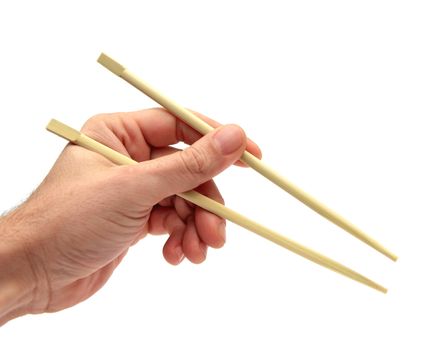 closeup of a hand using chopsticks over white