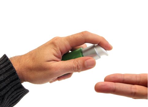 closeup of a hand putting cream on two fingers