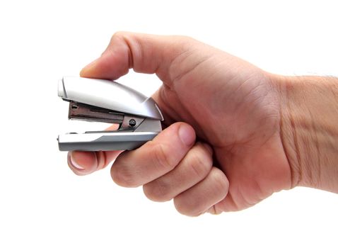 closeup of a hand using a little stapler