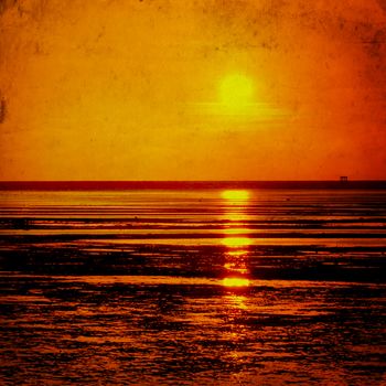 Seascape sunset in grunge and retro style