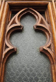 closeup of a church window with wood frame