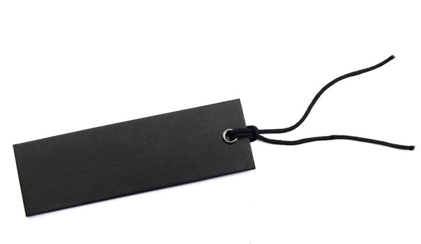 black sales tag with cord over white