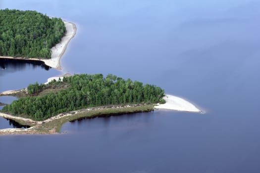 plane view of a wild island on a lake