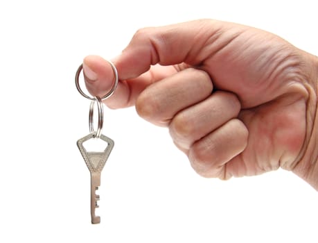 closeup of a hand holding a key ring with a single key