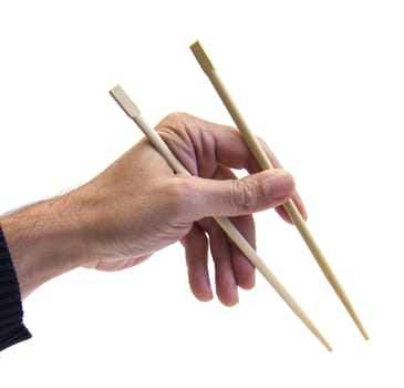 closeup of a hand using chopsticks over white