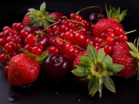 fresh red  fruit on black background