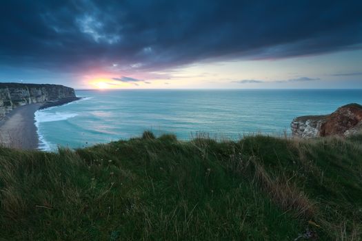 sunset over Atlantic ocean in France, Etretat, Normandy