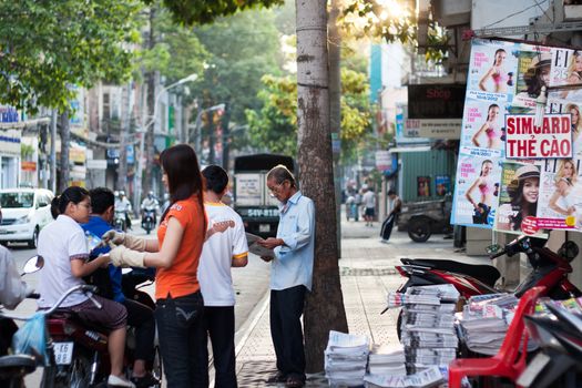 SAI GON, VIET NAM- APRIL 12: People at newspaper  store in Sai Gon, Viet nam on April 12, 2013