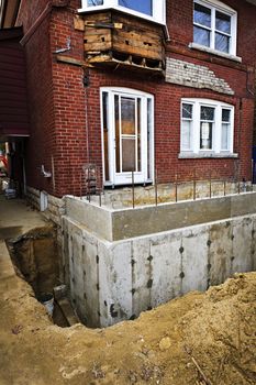 Building addition to residential house with new foundation